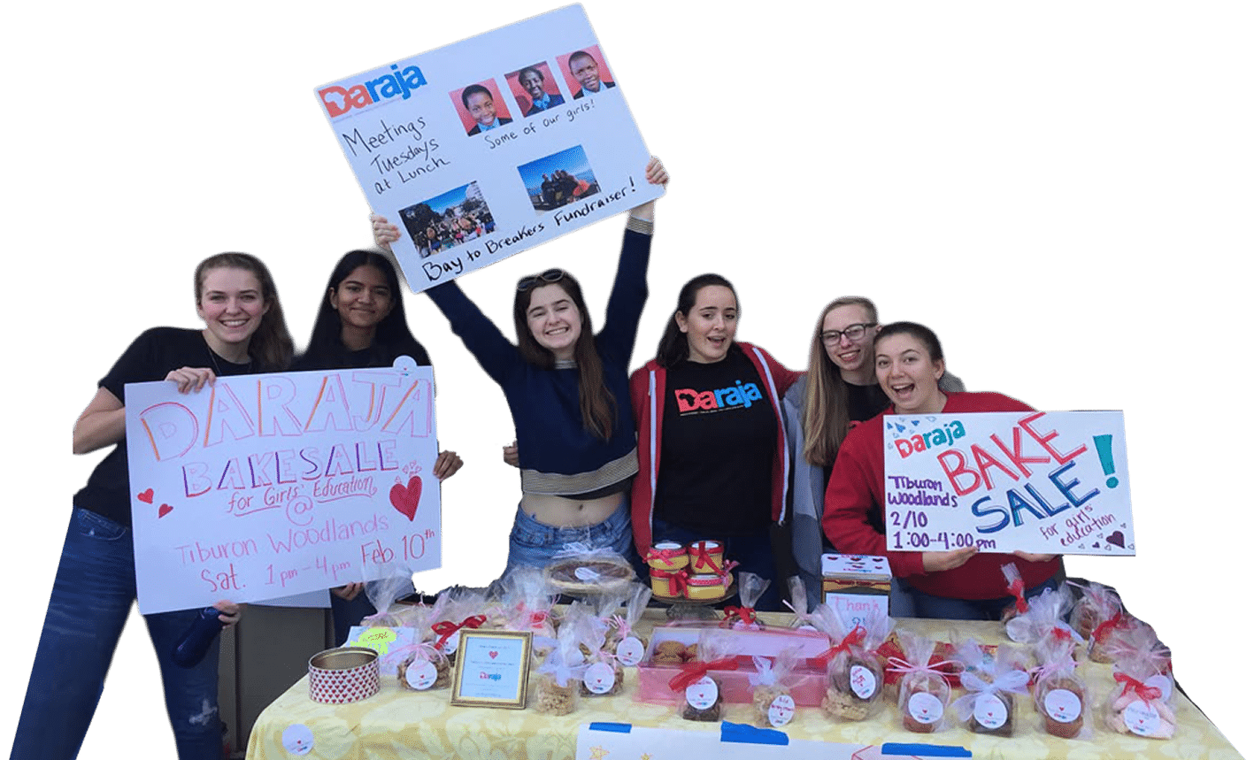 Daraja Club bake sale Students at a Daraja Club bake sale holding hand-made signs